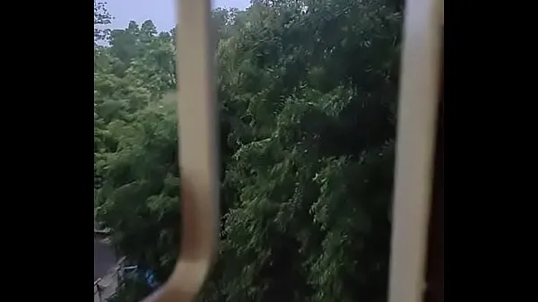 Watch Husband fucking wife in doggy style by enjoying the rain from window energy Clips